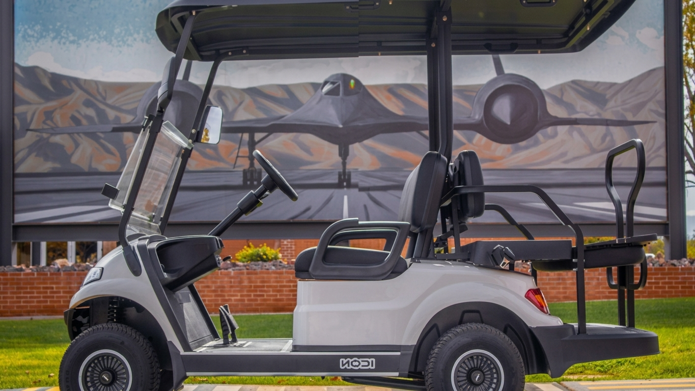 White electric golf cart, clean side profile